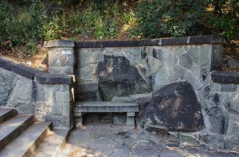 Stone bench and steps in park Stock Photos