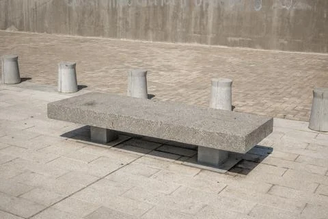Stone bench covered marble chips cylinders Stock Photos