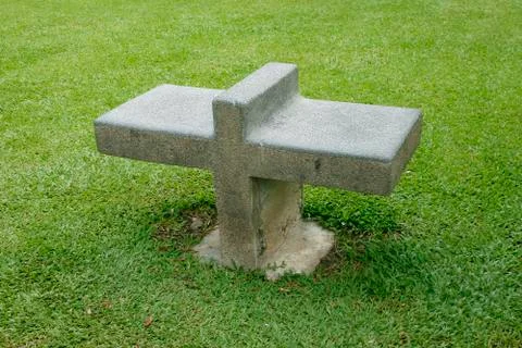 Stone bench on grass land Foto stock