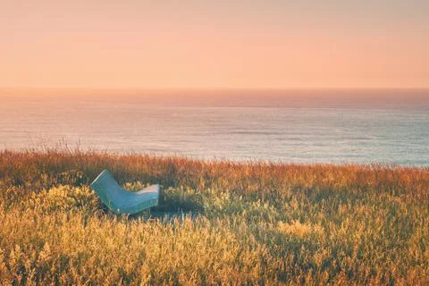Stone bench near the sea Stock Photos