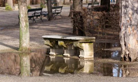 Stone bench in park Stock Photos