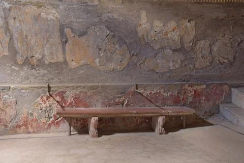 A stone bench in the public baths at the  Roman town of Herculaneum Stock Photos