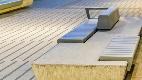 Stone bench on the sidewalk Stock Footage 302315918