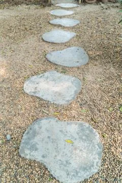 The Stone block walk path in the park with green grass background Stock-Fotos
