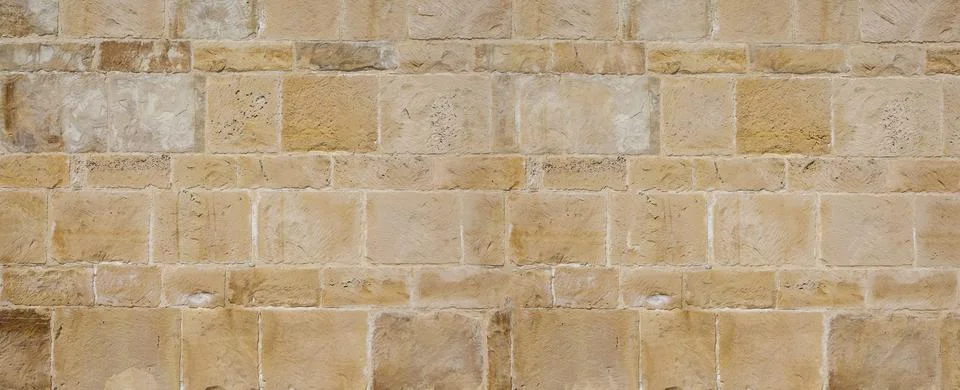 Stone block wall background creating natural texture pattern Stock Photos