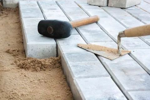Stone blocks laying is on sand base Foto stock