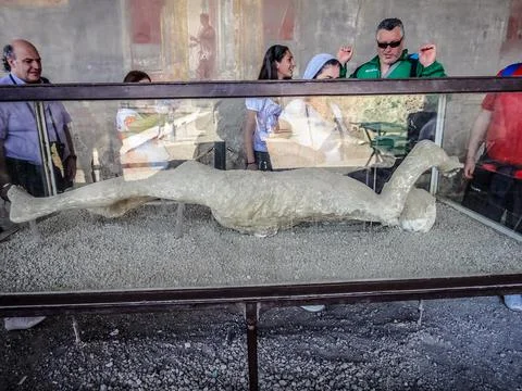 Stone body in a safe storage area in a glass cabinet, Pompeii Museum Stock Photos