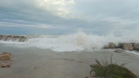 Stone breakwater on sandy seashore during storm Stock-Footage 170068357
