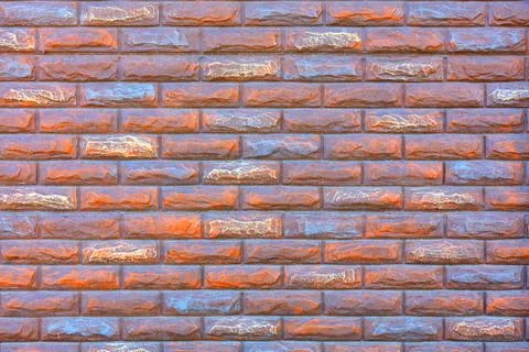 Stone brick wall is painted with red and blue paint, for use as background an Stock Photos