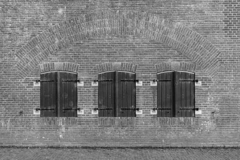 Stone brick wall with shutters at Military Fort Vechten in The Netherlands Stock Photos