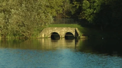 Stone bridge across the pond Stock Footage 81051248