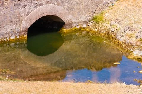 Stone Bridge and Arch Reflection in Guadalupe Fotos Stock