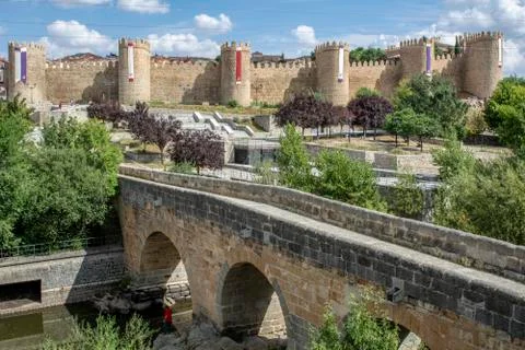 Stone bridge and the background wall of the city of Avila Stock Photos