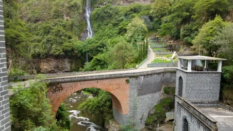 Stone bridge and waterfall at Las Lajas sanctuary Stock Footage 330983280