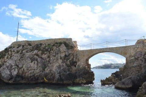 Stone Bridge of Cala Major Beach with a View of City Palma de Mallorca, Spain Stock Photos
