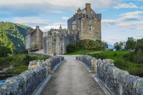 Stone bridge of Eilean Donan castle in early morning. Medieval Scottish castle Stock Photos