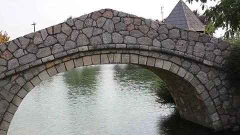 Stone bridge on the lake Stock Footage 141373634