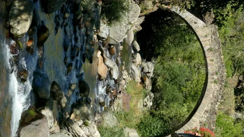 Stone bridge in a mountain river on the mountains of Pyrenees of Catalonia. Stock Footage 170578491