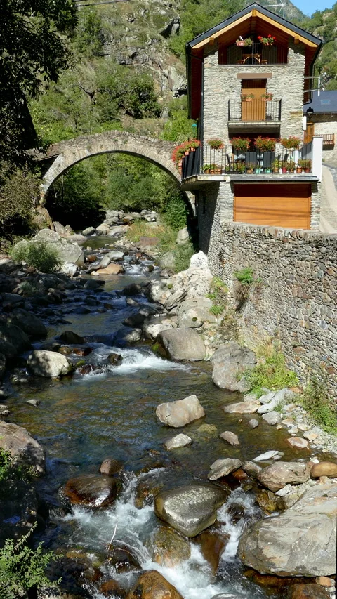 Stone bridge in a mountain river on the mountains of Pyrenees of Catalonia. Stock Footage 170578910