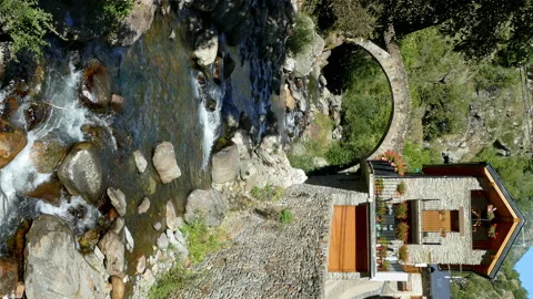 Stone bridge in a mountain river on the mountains of Pyrenees of Catalonia. Video stock 170579046