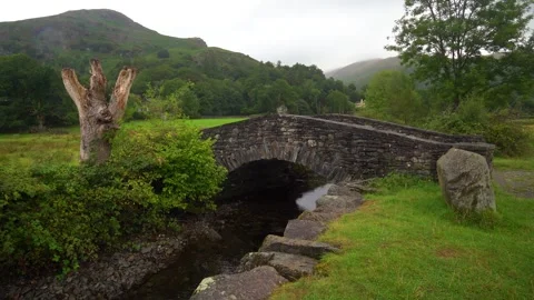 Stone bridge over grasmere beck Stock Footage 346920987