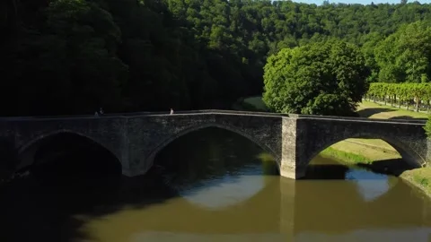 A Stone Bridge Over a River in Bouillon Stock Footage 278351007