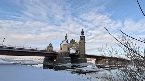 Stone bridge over the river with floating ice floes Stock Footage 297841402