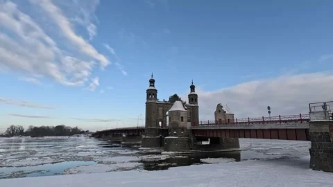 Stone bridge over the river with floating ice floes. Stock Footage 297842179