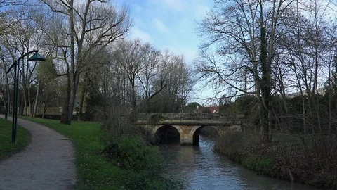 Stone bridge over a river in nature during a winter morning Stock Footage 122035015