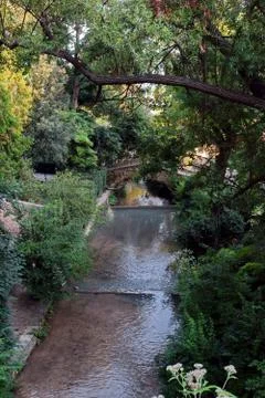 Stone bridge over the river. Stock Photos
