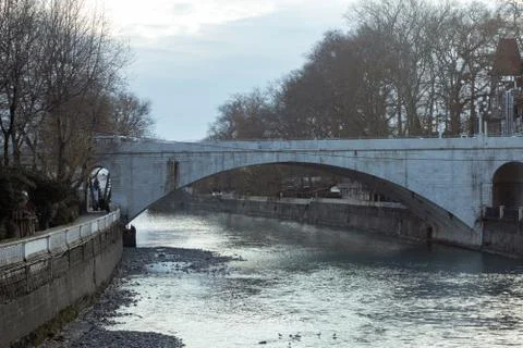 Stone bridge over the river Stock Photos