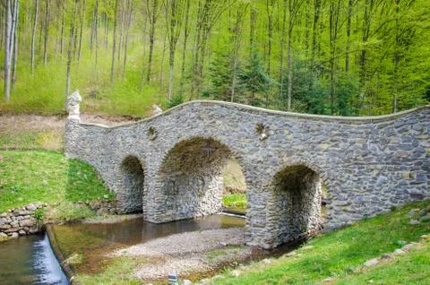 Stone bridge over a small river. Voevodyno resort. beautiful landscape in the Stock Photos