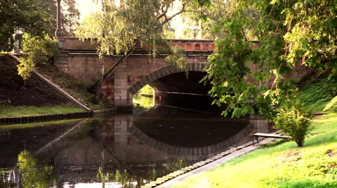 Stone Bridge under tree branches Stock Footage 35257704