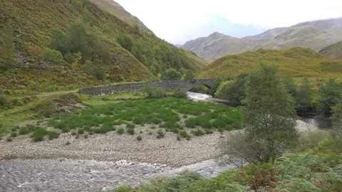 Stone Bridge in a Valley and Small River in Scotland Stock Footage 85242620