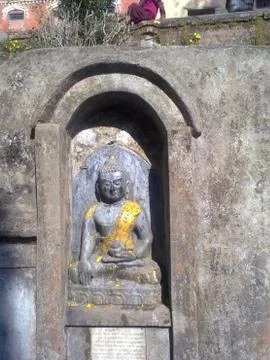 Stone Buddha statue in the wall Stock Photos