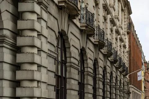 Stone Building Facade with Arched Windows and Balconies in Liverpool, UK. Stock Photos