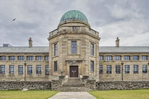 Stone building features a green copper dome Stock Photos