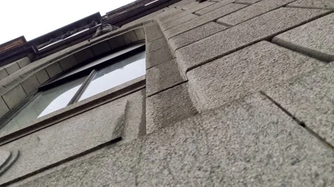 Stone building with windows. Stone house in the close-up Stock Footage 160548441