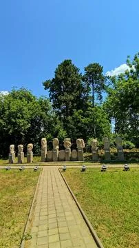 Stone busts and statues group in the garden of the Cuza Palace in Ruginoasa. Stock Photos