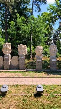 Stone busts and statues group in the garden of the Cuza Palace in Ruginoasa. Stock Photos