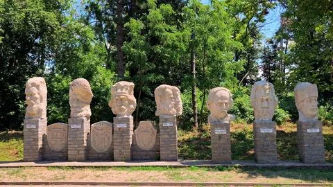 Stone busts and statues group in the garden of the Cuza Palace in Ruginoasa. Stock Photos