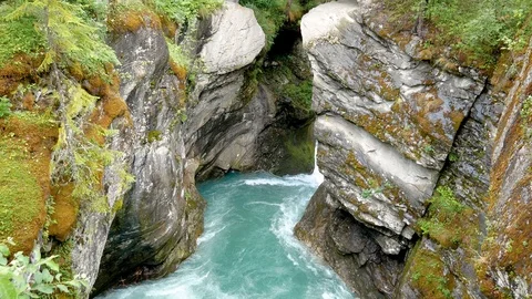 Stone Canyon In The Mountains Through Which Flows The Pure Turquoise River Stock Footage 102168746