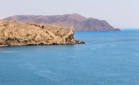 Stone cape in the sea. Stock Photos