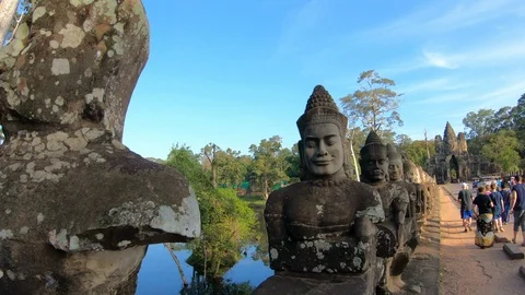 Stone carved statues of Devas on the bridge to Angkor Thom Stock Footage 108154818