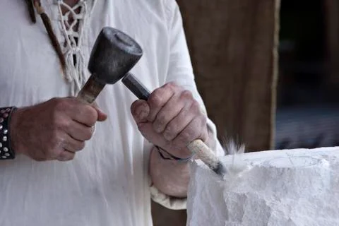 A stone carver at work Stock Photos