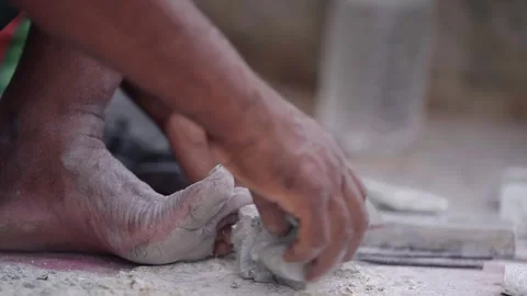 Stone Carving Artisan Working with Chisel on Traditional Handmade Sculpture 스톡 동영상 311024011