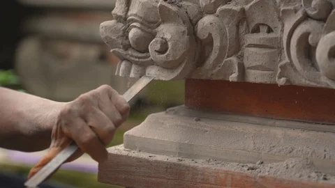 Stone carving master is making statue of a Balinese deity. Video stock 117708997