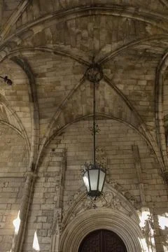 Stone ceiling in gothic temple with old lamp 스톡 사진