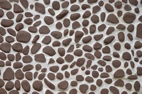 Stone in cement wall Stock Photos