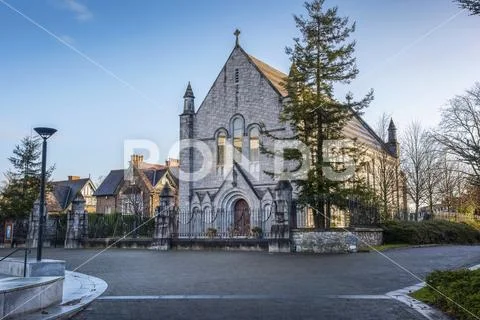 A stone church building along a quaint street,Ireland Stock Photos